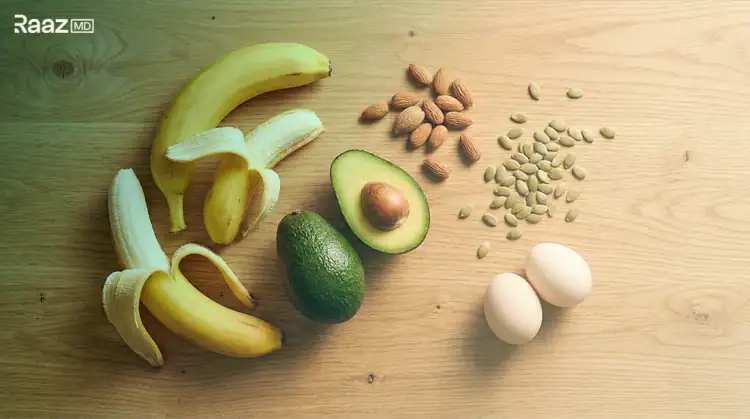 Bananas, almonds, an avocado, pumpkin seeds and eggs on a wooden table, foods that support sexual health during premature ejaculation treatment